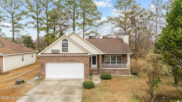 view of front of property with a porch and a garage