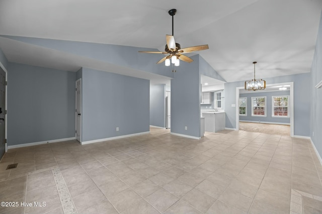 unfurnished living room featuring light tile patterned flooring, lofted ceiling, sink, and ceiling fan with notable chandelier