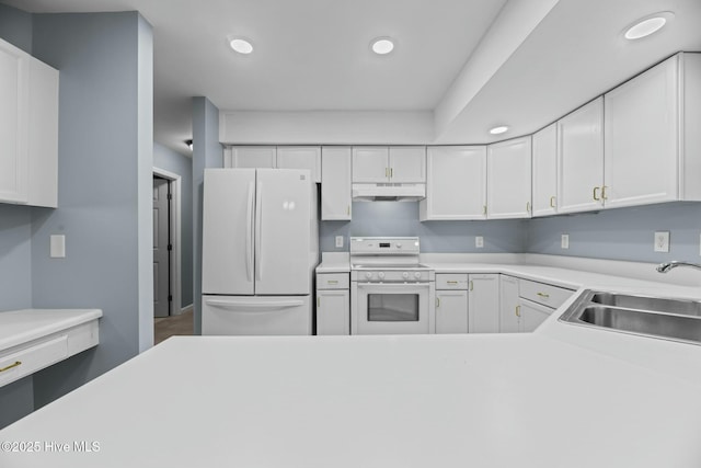 kitchen featuring white cabinetry, sink, and white appliances