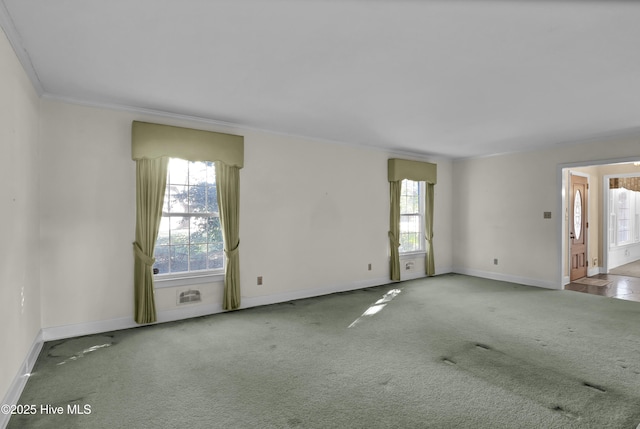 unfurnished room with light carpet, a wealth of natural light, and ornamental molding