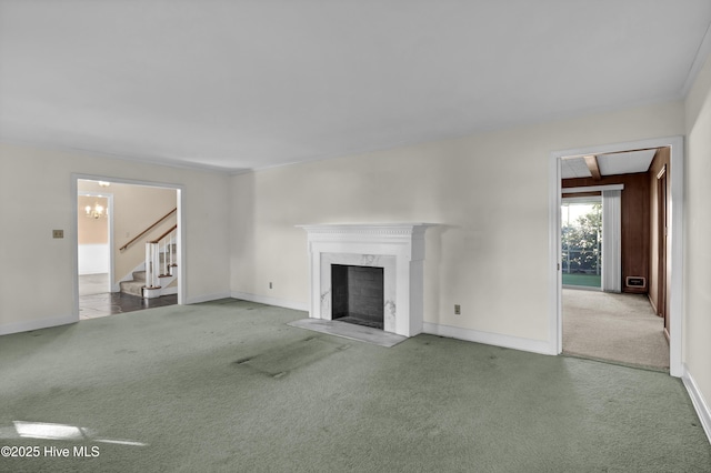 unfurnished living room with carpet floors and a premium fireplace