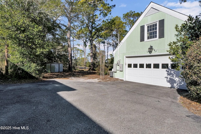 view of property exterior featuring a garage