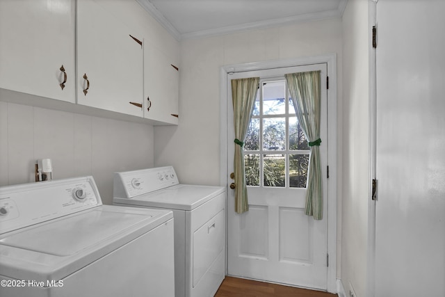 laundry room featuring cabinets, dark hardwood / wood-style floors, ornamental molding, and washing machine and dryer