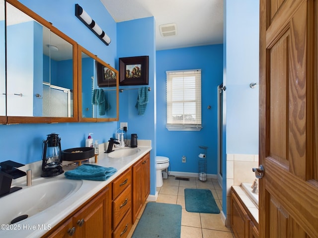 full bathroom featuring toilet, tile patterned flooring, plus walk in shower, and vanity