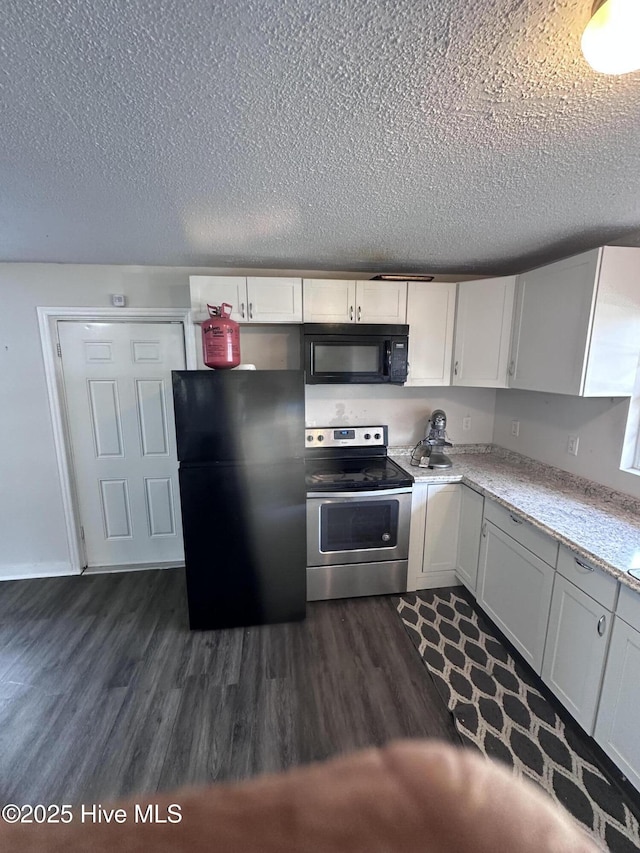 kitchen featuring a textured ceiling, black appliances, dark wood-style floors, and white cabinetry