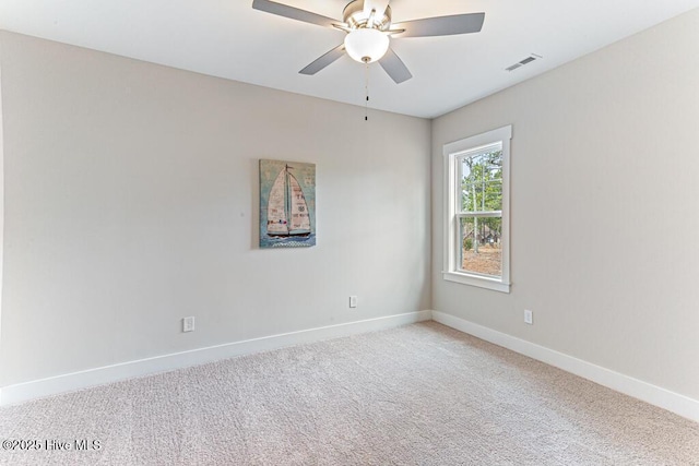 empty room featuring carpet floors and ceiling fan