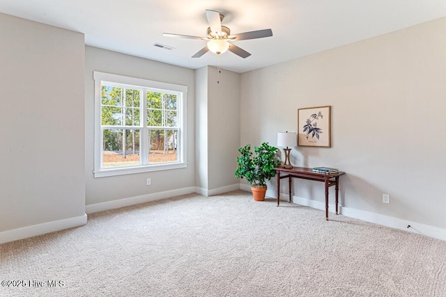 interior space with ceiling fan