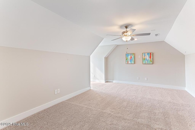 bonus room featuring lofted ceiling, ceiling fan, and carpet flooring