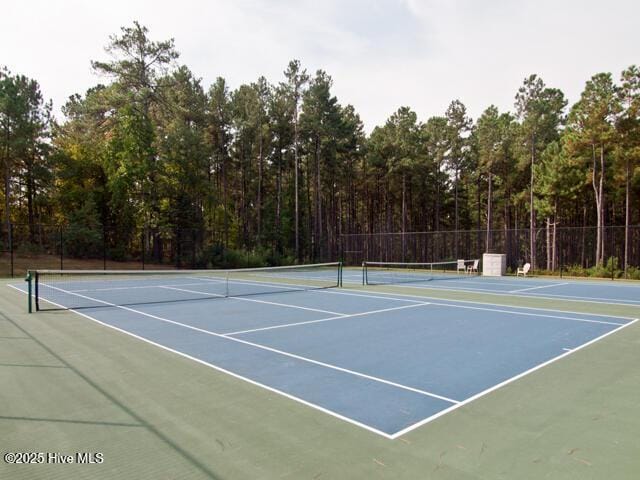 view of tennis court featuring basketball court