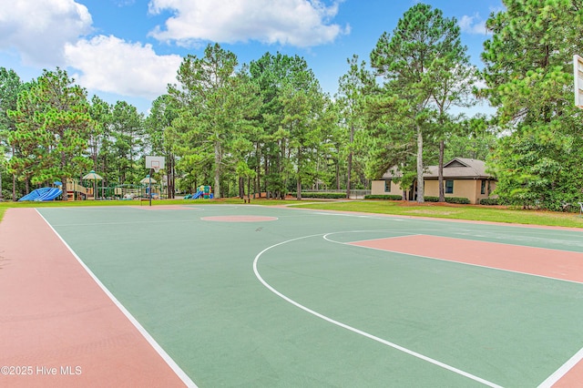 view of sport court with a playground