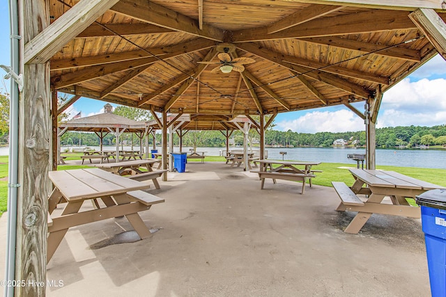 surrounding community with a gazebo and a water view