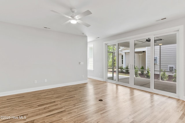 spare room featuring ceiling fan and light wood-type flooring