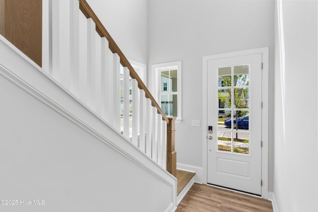 entryway featuring plenty of natural light and light hardwood / wood-style floors