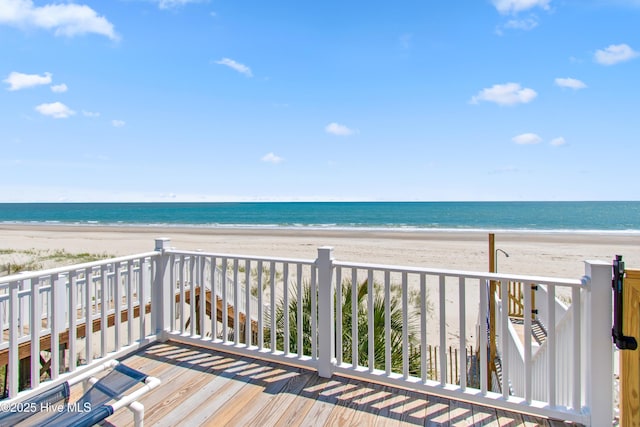 exterior space featuring a water view and a view of the beach