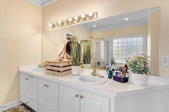 bathroom featuring crown molding, a shower with shower door, and vanity