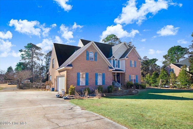 view of front property featuring a garage and a front lawn