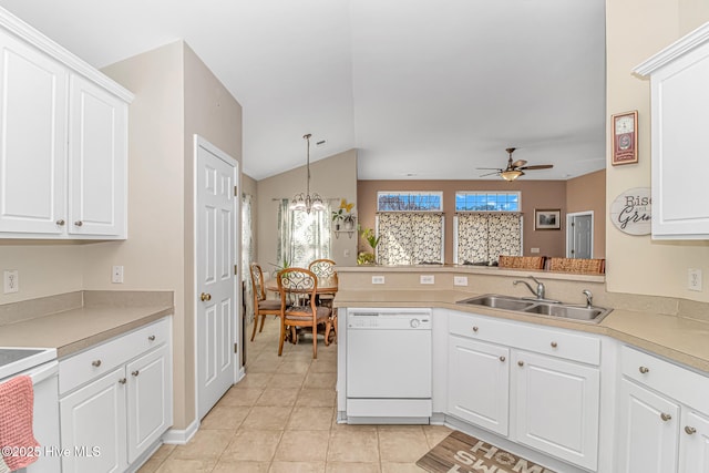 kitchen with white cabinetry, white appliances, and kitchen peninsula