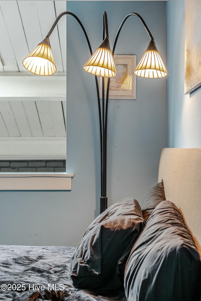 bedroom featuring beamed ceiling and wood ceiling