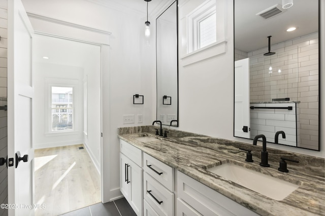 bathroom with vanity and tile patterned flooring