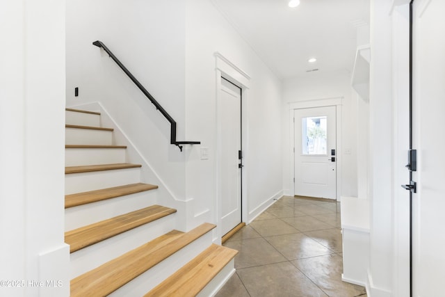 entryway featuring light tile patterned floors