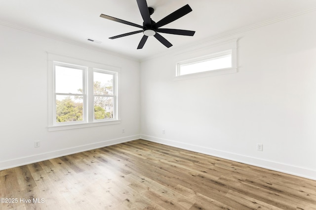 unfurnished room featuring ceiling fan, ornamental molding, and light wood-type flooring