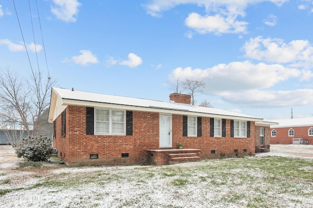 ranch-style house featuring brick siding, crawl space, and a front yard