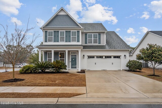 view of front facade with a garage and a porch