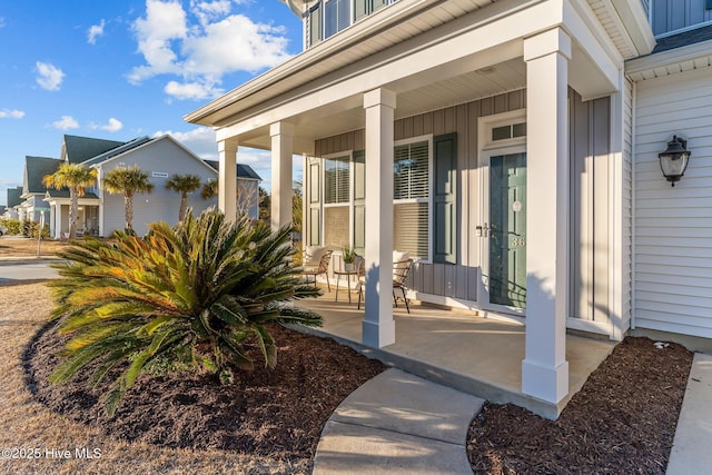 view of exterior entry with covered porch