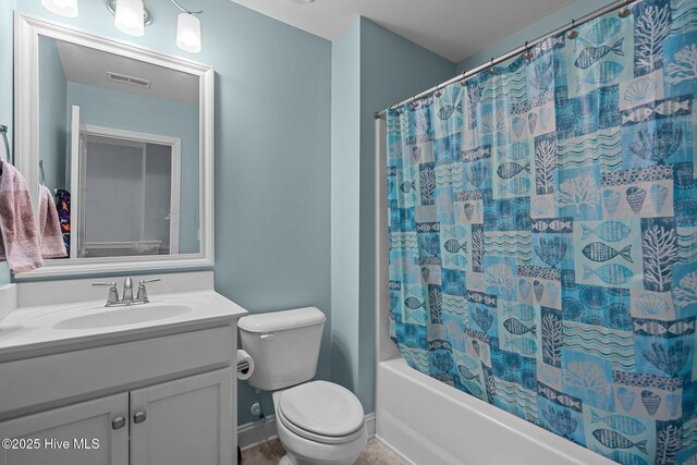 bathroom with vanity, toilet, and a shower with shower curtain