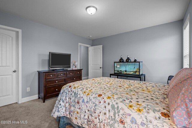 bedroom featuring light colored carpet