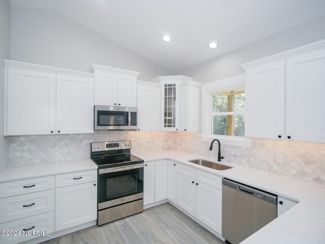 kitchen featuring sink, white cabinetry, and stainless steel appliances