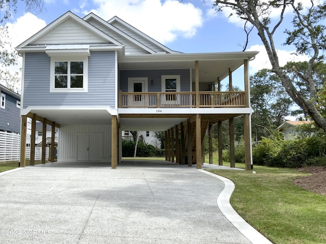 coastal home featuring a front lawn, a porch, and a carport