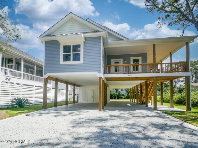 coastal home with a porch and a carport