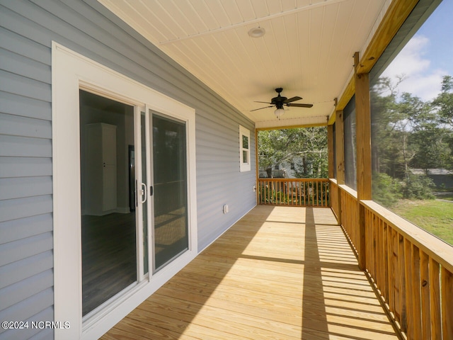 wooden terrace featuring ceiling fan