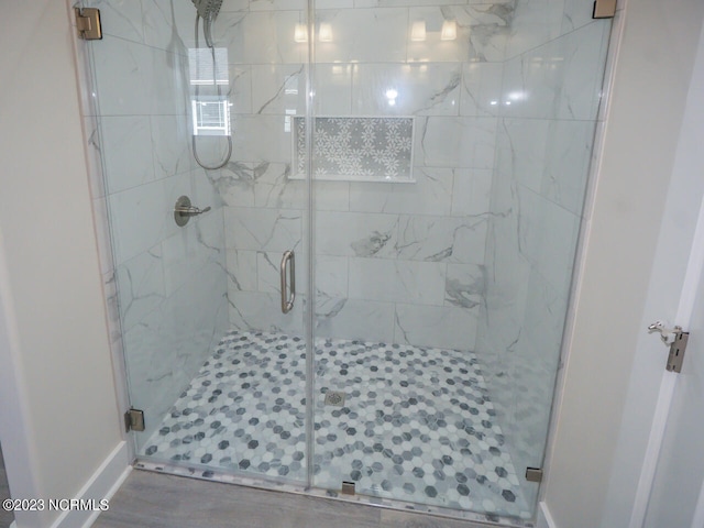 bathroom featuring a shower stall