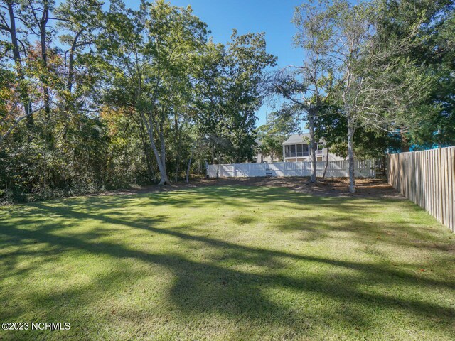 view of yard with a fenced in pool