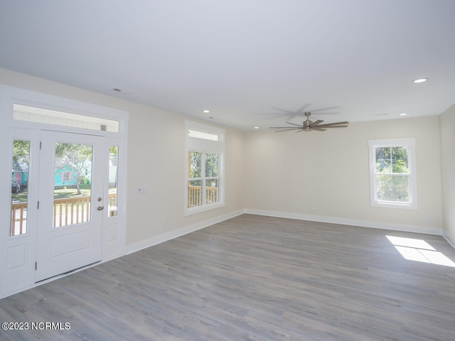 foyer entrance with hardwood / wood-style flooring and ceiling fan