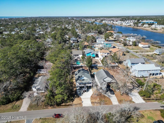 drone / aerial view with a residential view and a water view