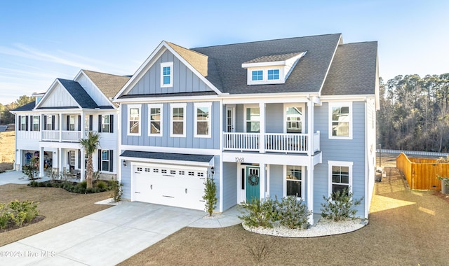 view of front of property with a balcony and a garage