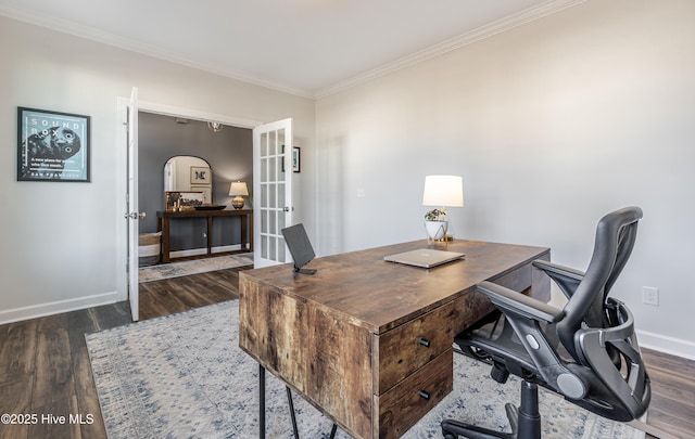 home office with crown molding, dark wood-type flooring, and french doors