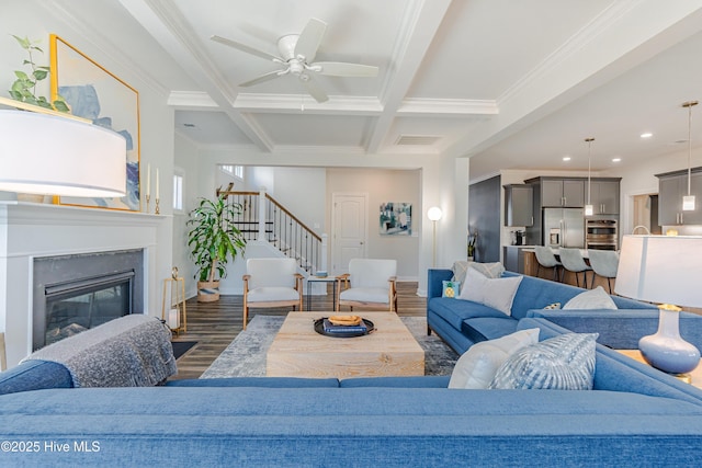 living room with dark hardwood / wood-style flooring, crown molding, beamed ceiling, and coffered ceiling