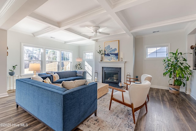 living room featuring beamed ceiling, crown molding, coffered ceiling, dark hardwood / wood-style flooring, and ceiling fan