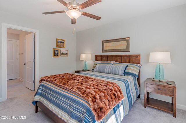 bedroom featuring ceiling fan and light colored carpet