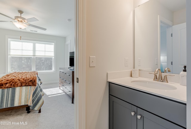 bathroom featuring ceiling fan and vanity