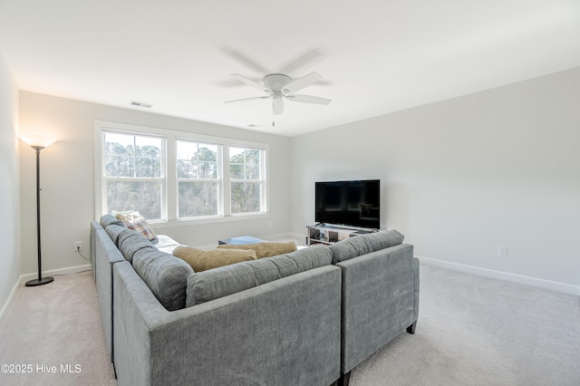 living room with light colored carpet and ceiling fan