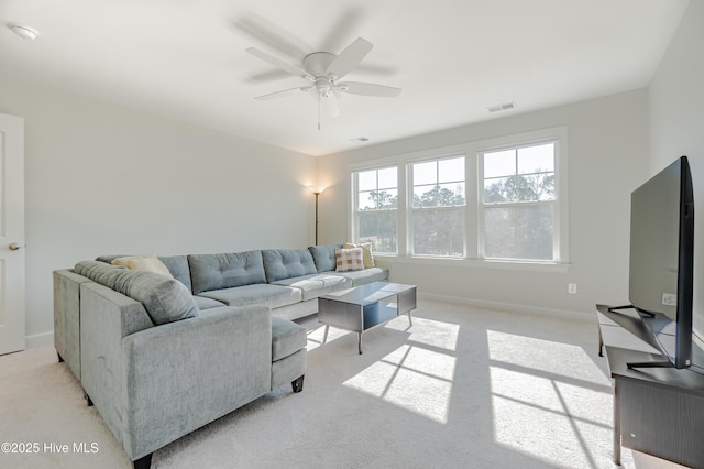 living room featuring ceiling fan and light carpet