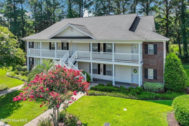 view of front of house with a front lawn and a porch