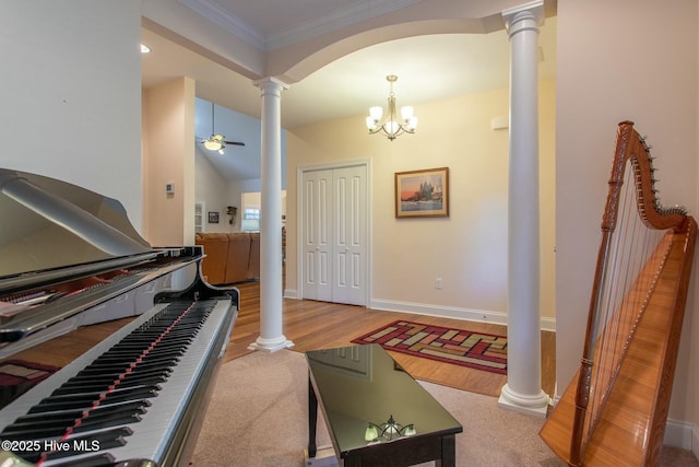 interior space featuring ceiling fan, ornamental molding, light hardwood / wood-style flooring, and ornate columns