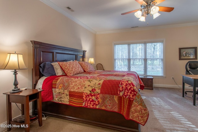 carpeted bedroom featuring ornamental molding and ceiling fan