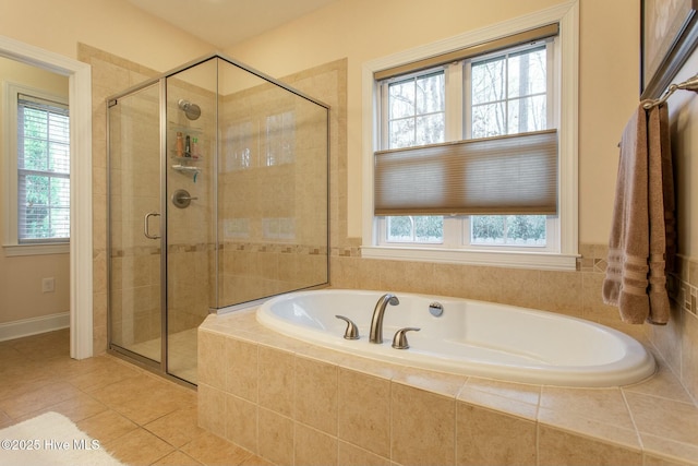 bathroom featuring tile patterned floors, plenty of natural light, and independent shower and bath